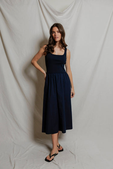 Woman in a navy midi dress