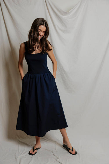 Woman in a navy midi dress