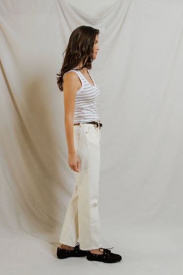 Woman in a white striped tank