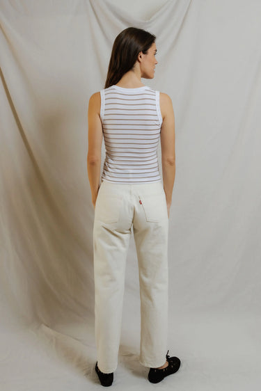 Woman in a white striped tank