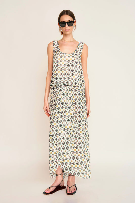 Woman in a patterned white skirt