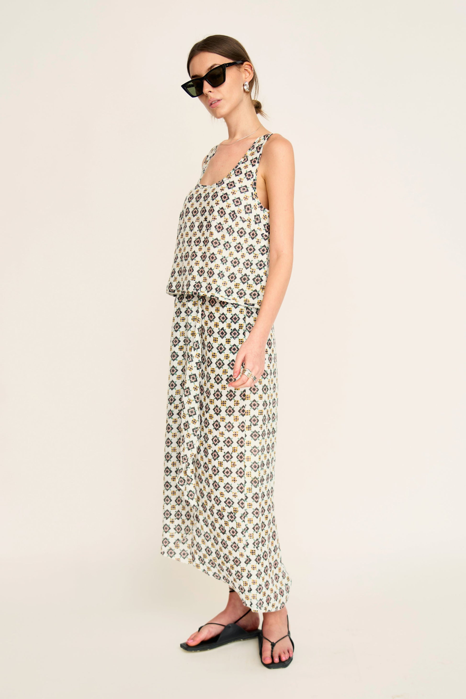 Woman in a patterned white skirt
