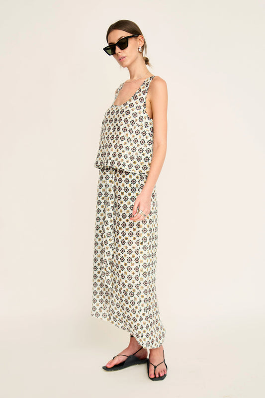 Woman in a patterned white skirt