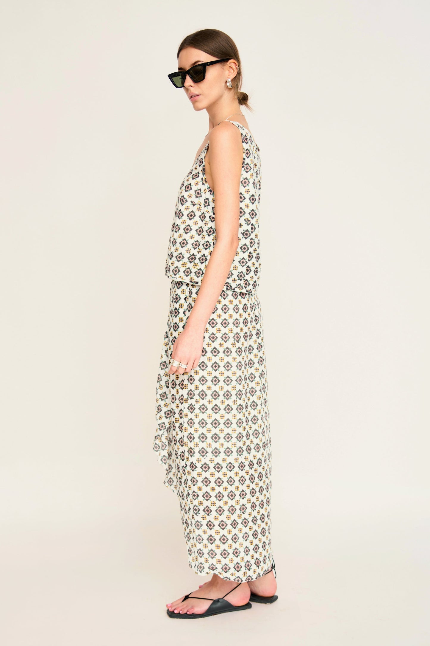 Woman in a patterned white skirt