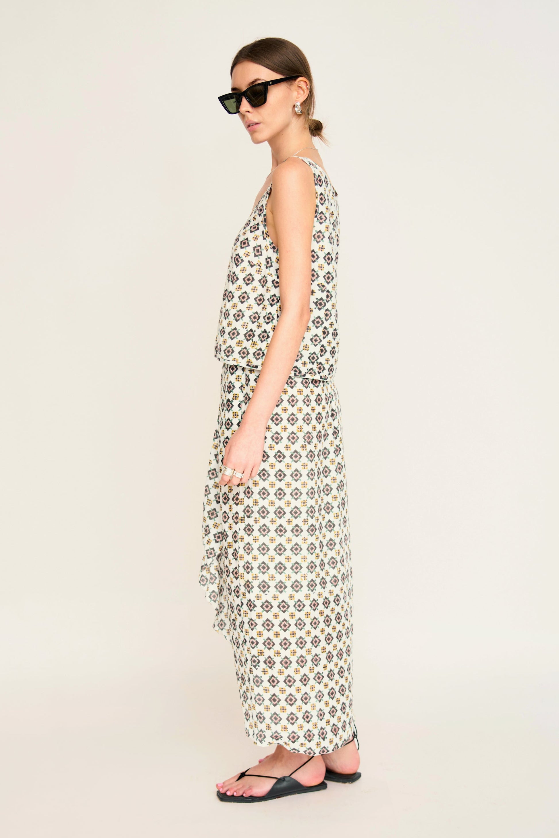 Woman in a patterned white skirt