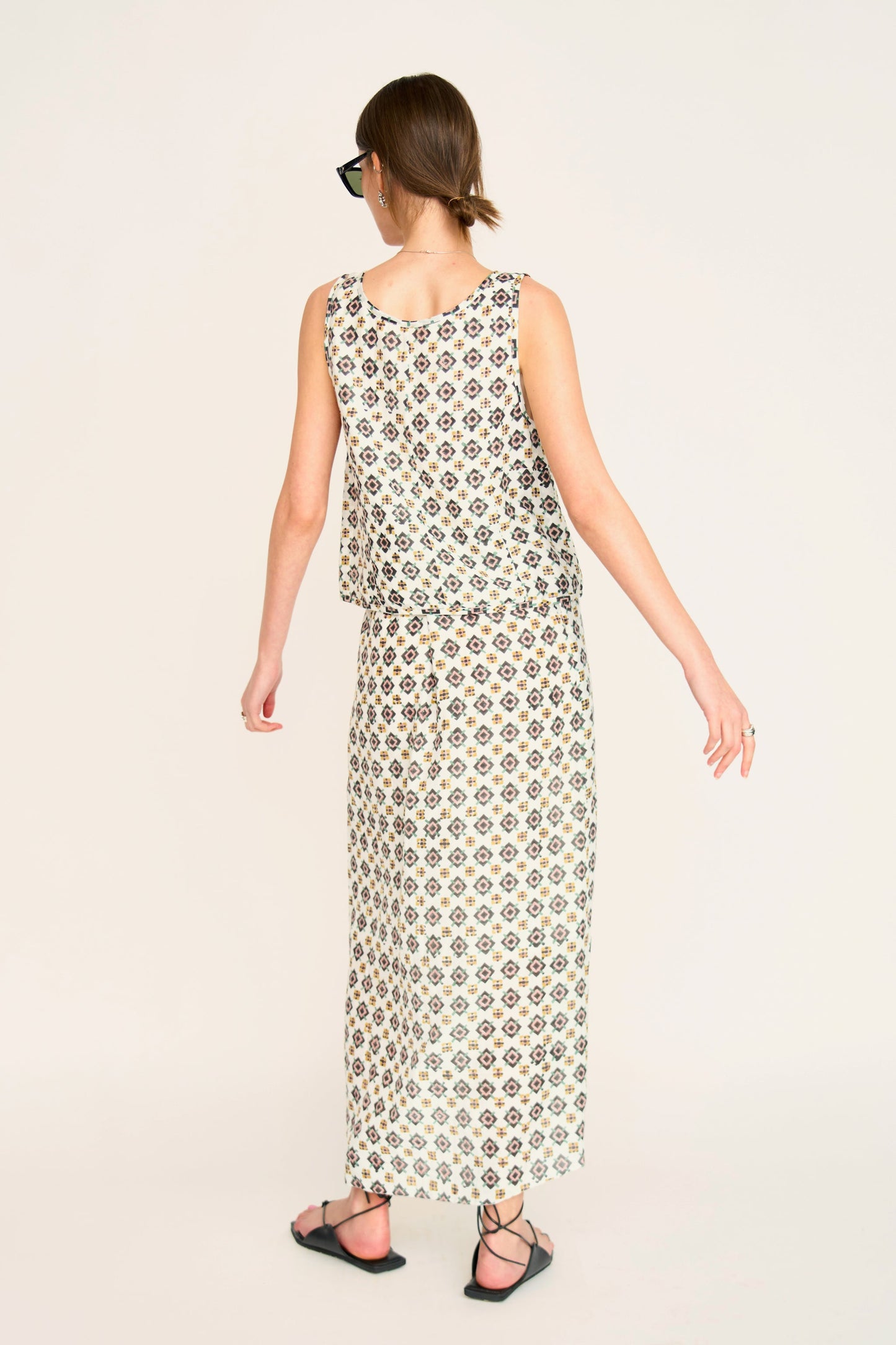 Woman in a patterned white skirt