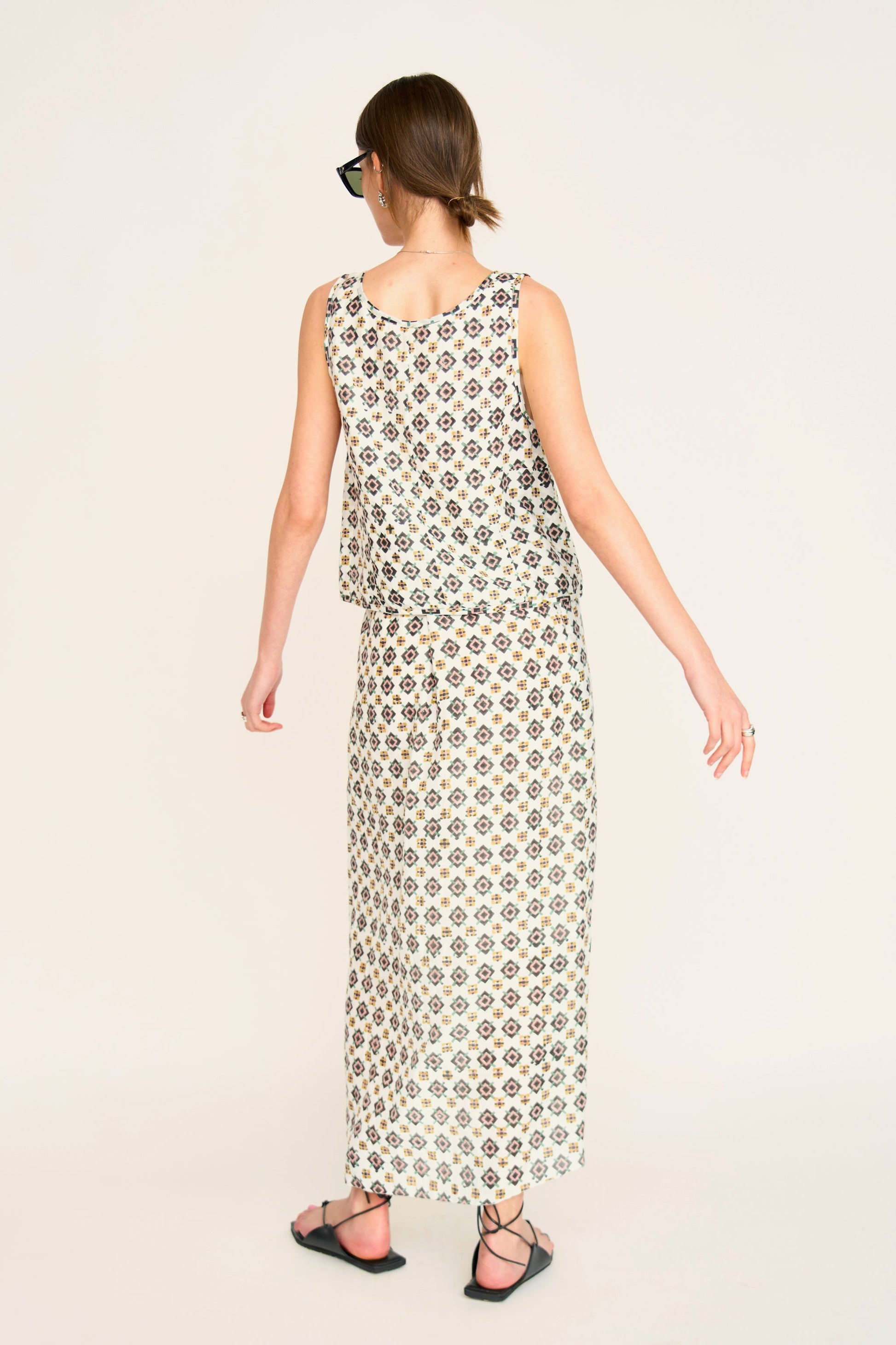 Woman in a patterned white skirt
