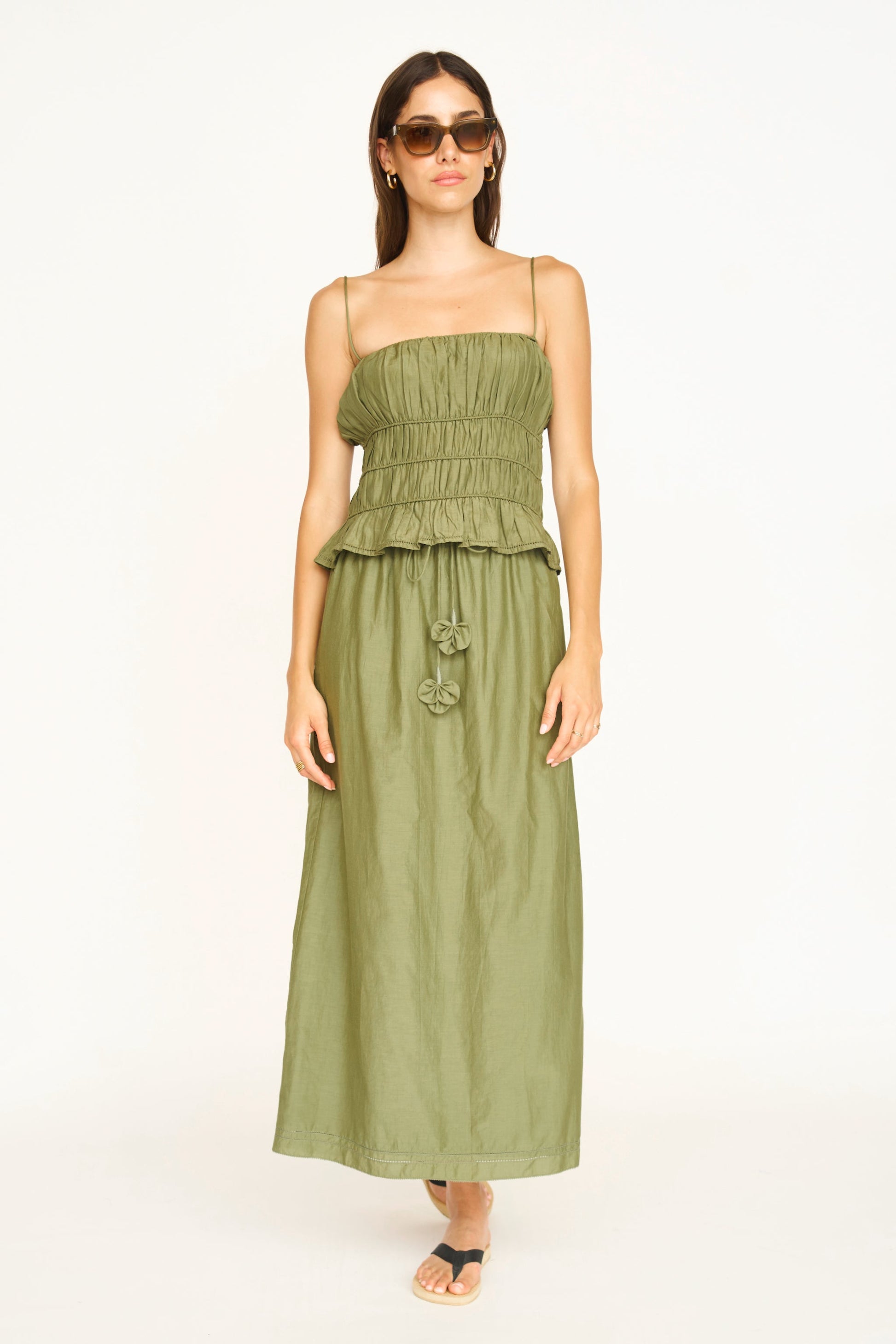 Woman wearing a dill green maxi skirt