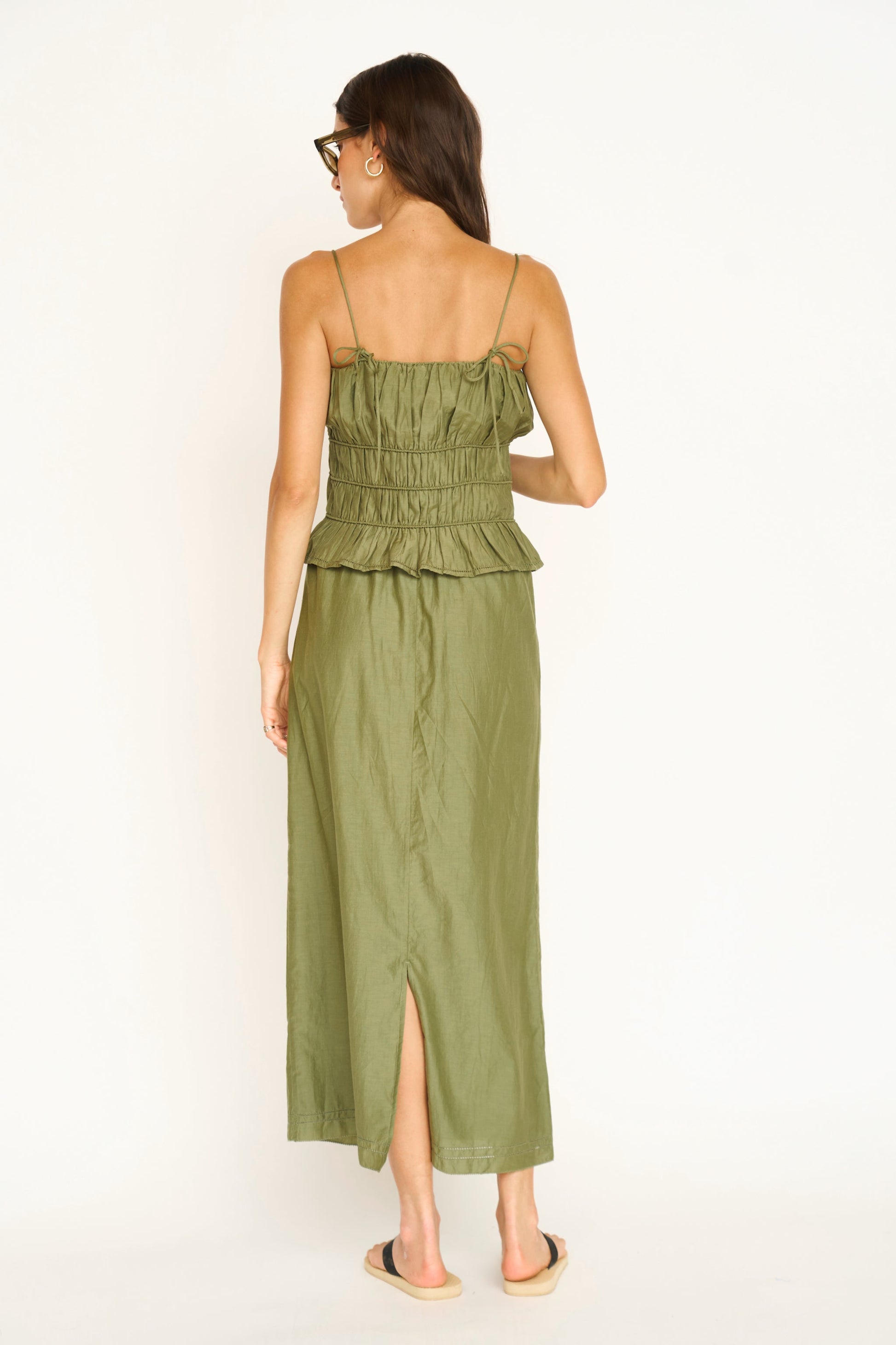 Woman wearing a dill green maxi skirt