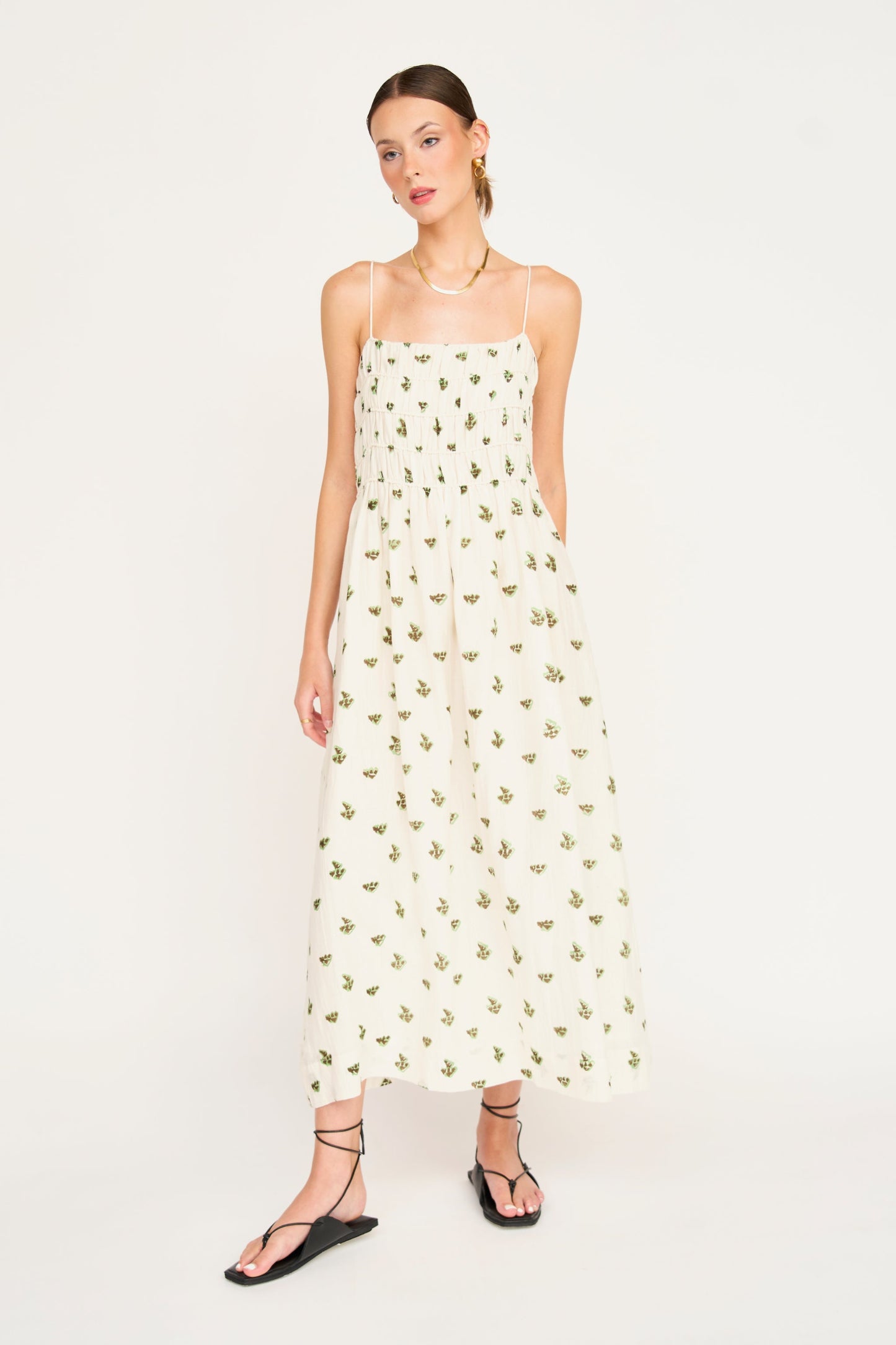 Woman in a white patterned dress