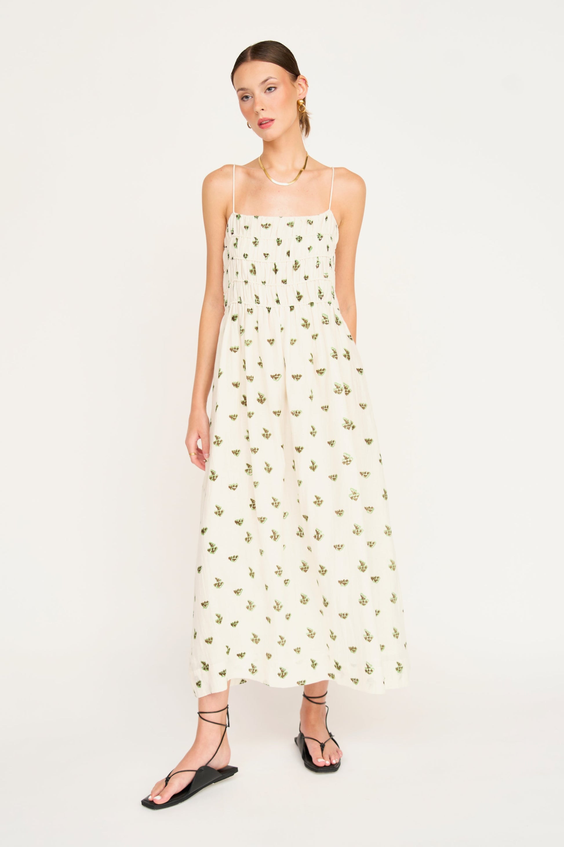 Woman in a white patterned dress