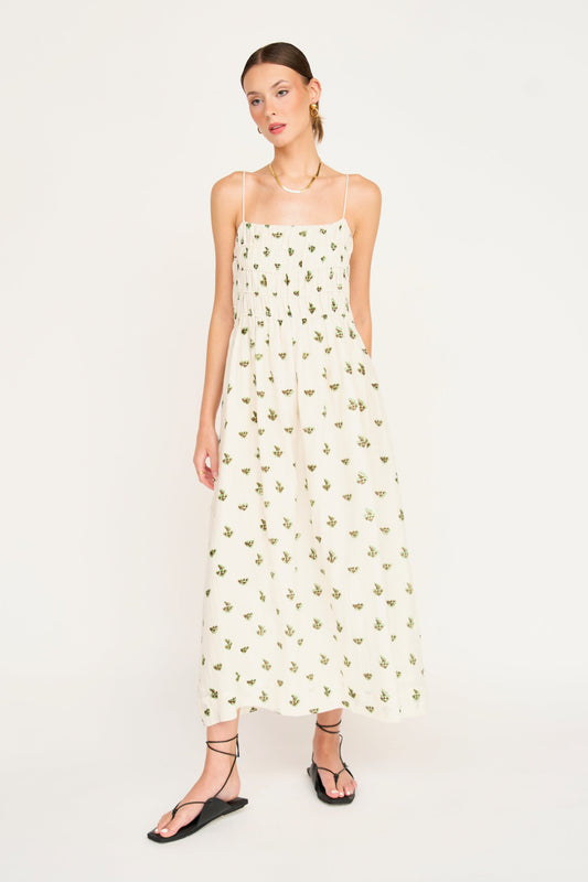 Woman in a white patterned dress