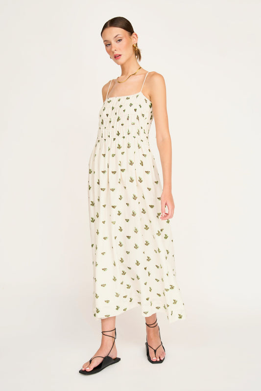 Woman in a white patterned dress