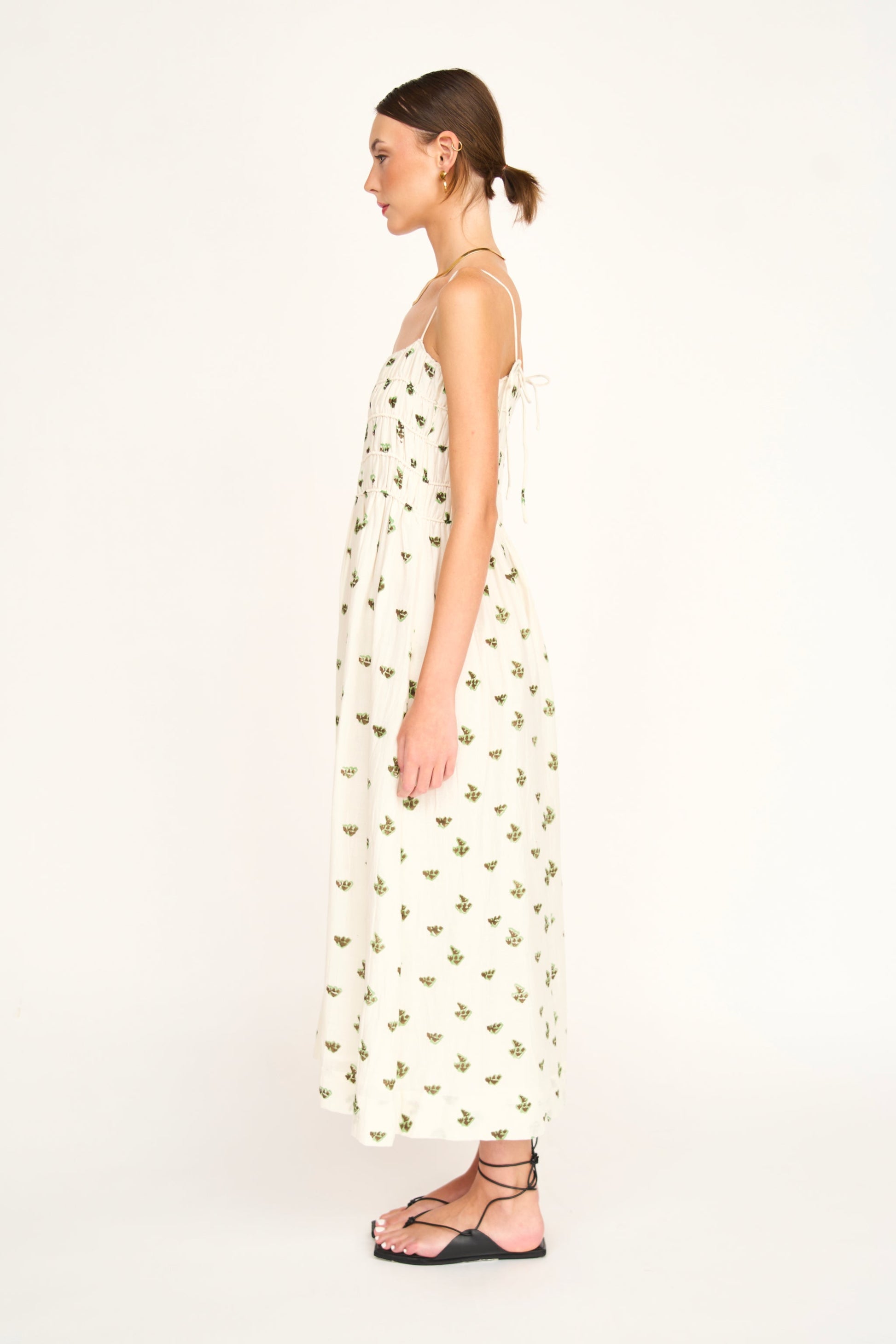 Woman in a white patterned dress