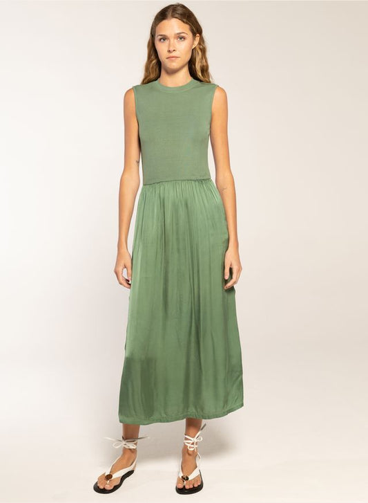 Woman in a celadon midi dress