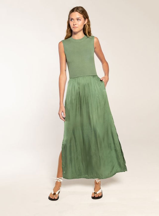 Woman in a celadon midi dress