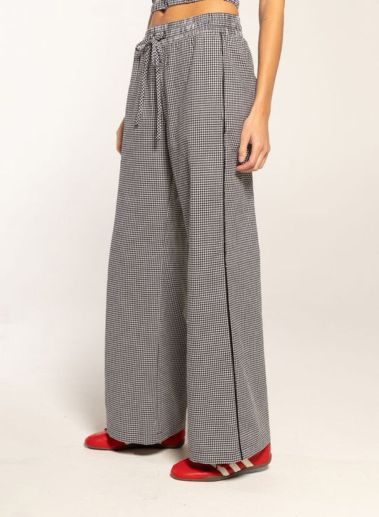 woman wearing black gingham pants