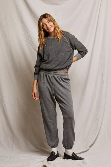 Woman wearing a dark heather gray sweatshirt