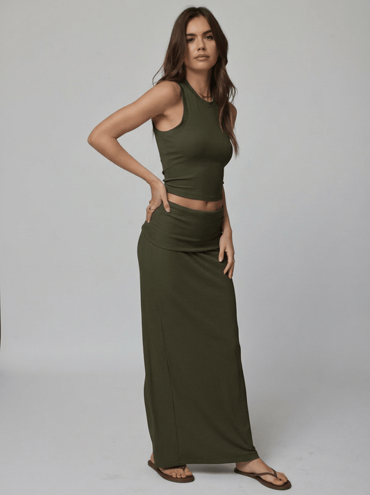 Woman wearing an olive sleeveless top and skirt