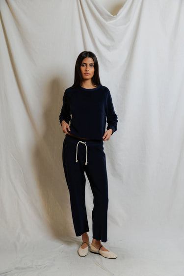 Woman wearing a navy blue sweatshirt