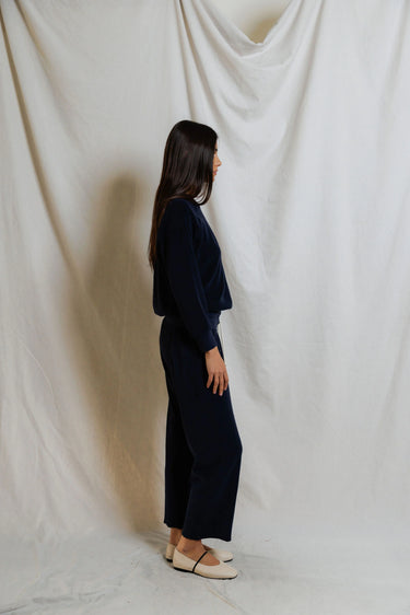 Woman wearing a navy blue sweatshirt