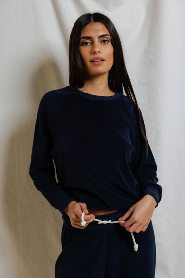 Woman wearing a navy blue sweatshirt