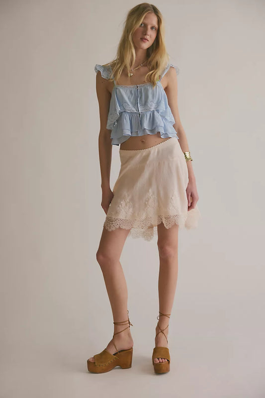 Woman wearing a beige lace skirt