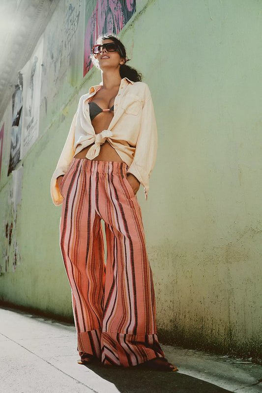 Woman wearing coral striped trousers