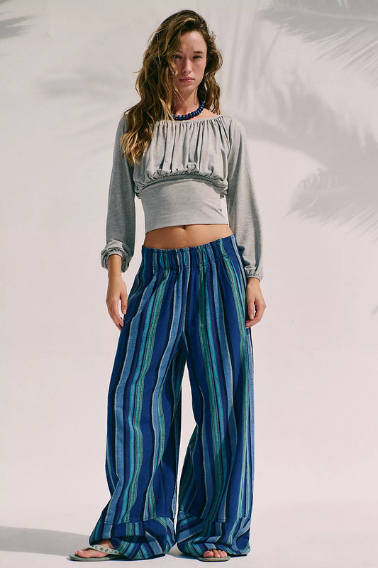 Woman wearing navy blue combo striped pants 