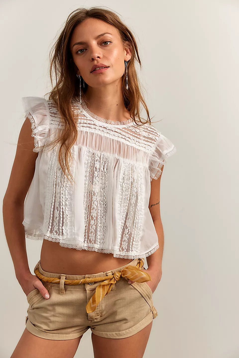 Woman wearing a white lace top 
