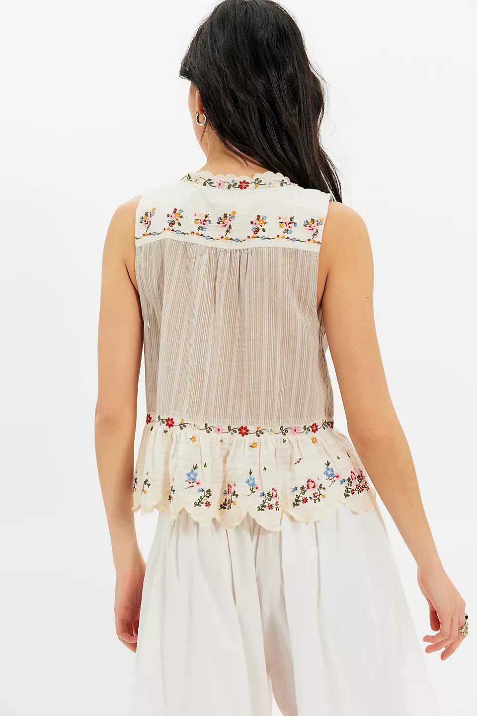 Woman wearing a floral sleeveless top