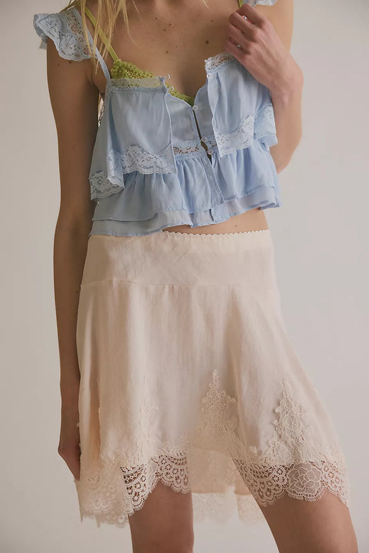 Woman wearing a beige lace skirt