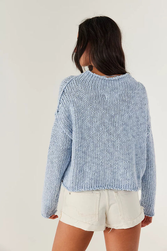 Woman wearing a blue knitted sweater