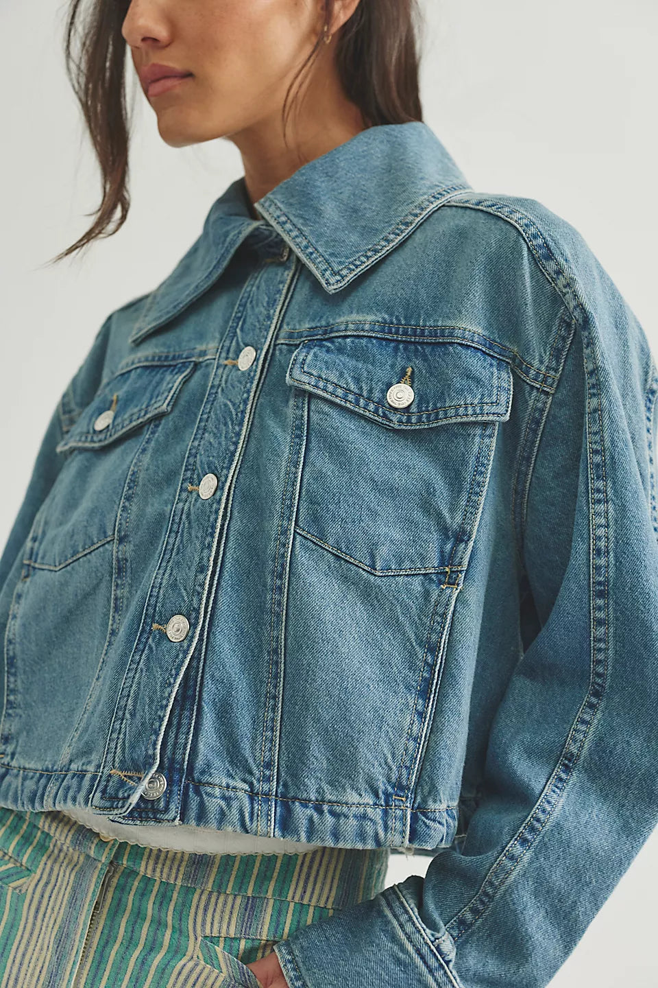 Woman wearing a denim jacket 