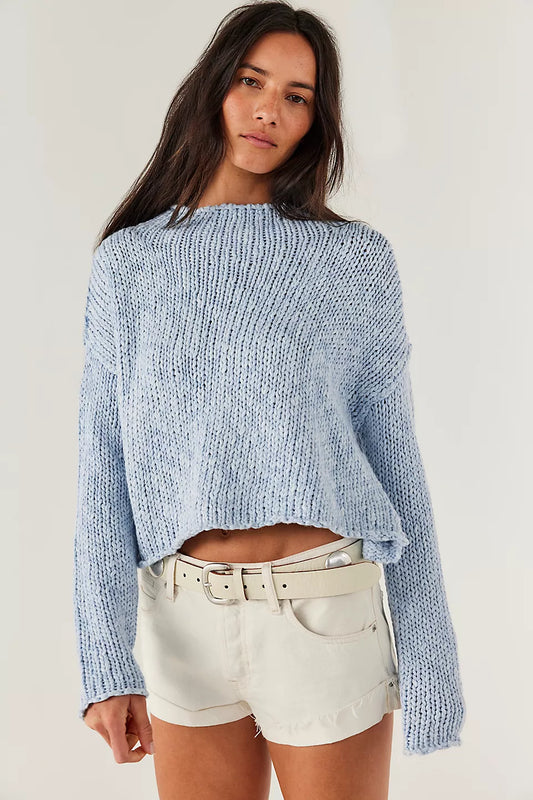 Woman wearing a blue knitted sweater