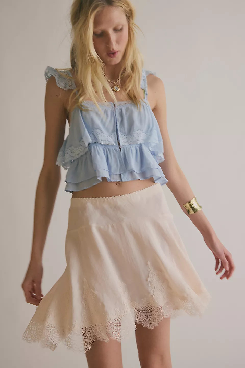 Woman wearing a beige lace skirt