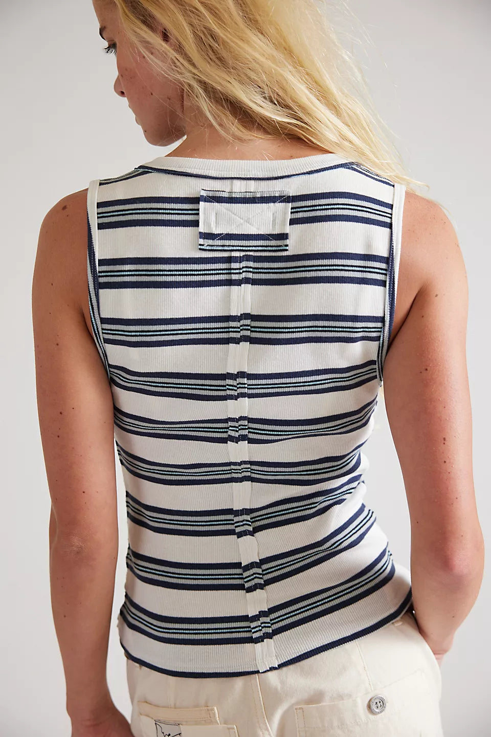 Woman wearing a striped tank top