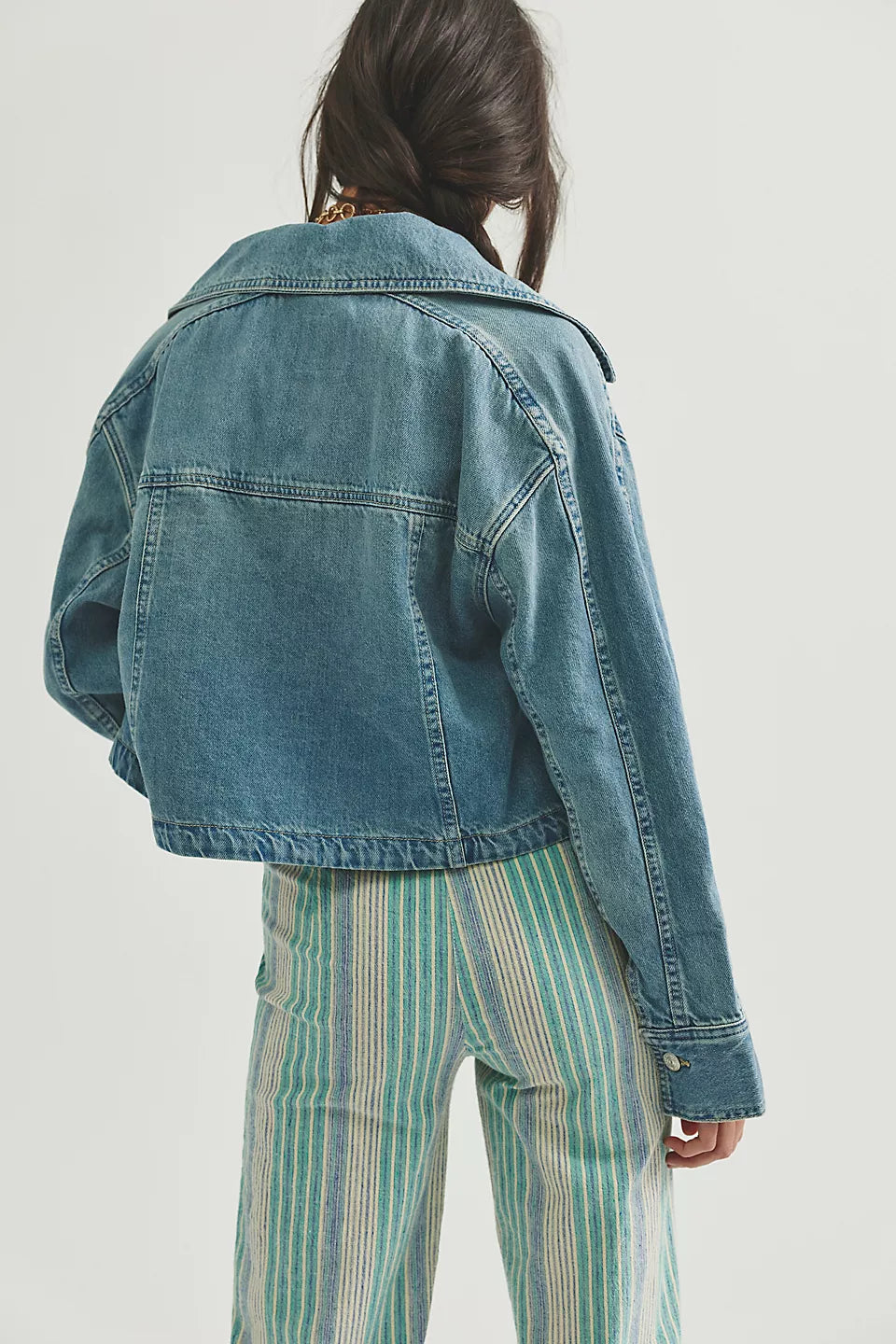 Woman wearing a denim jacket 