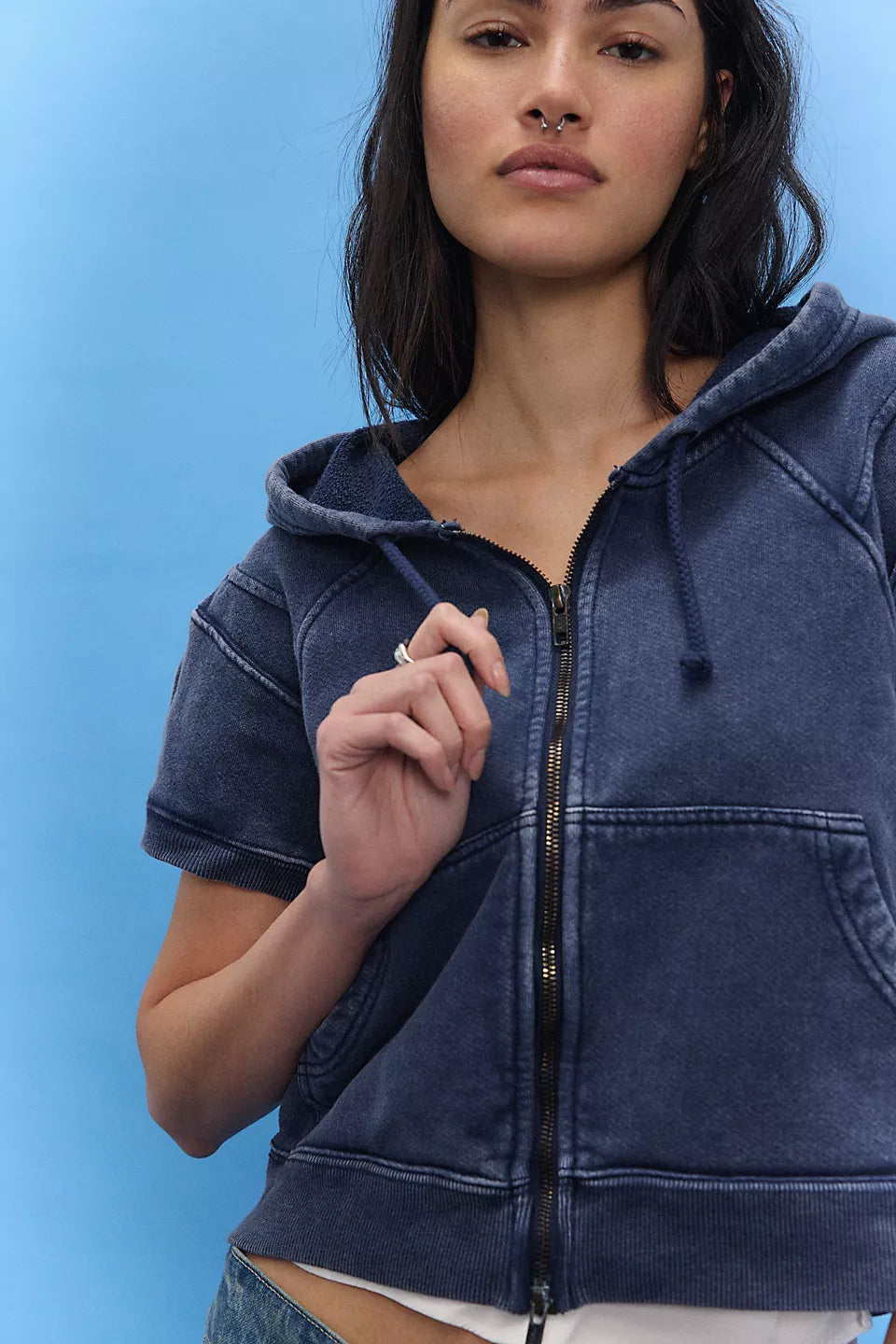 Woman wearing a blue hoodie