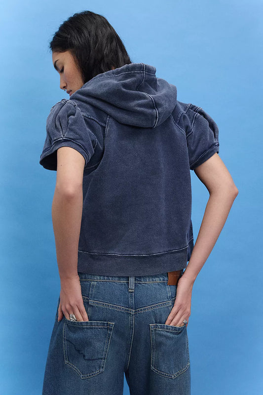 Woman wearing a blue hoodie