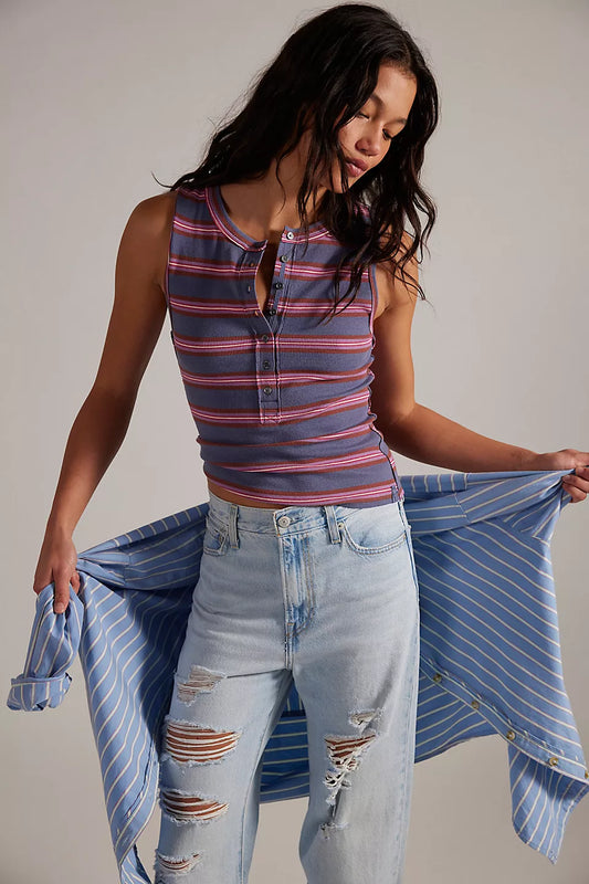 Woman wearing a striped tank top 