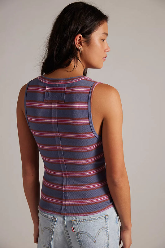 Woman wearing a striped tank top 