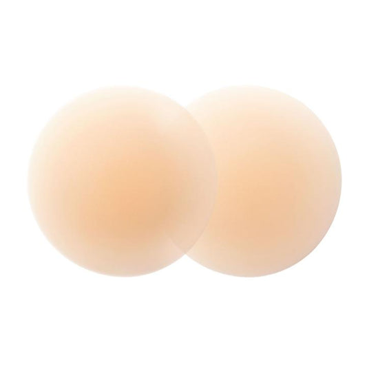 Beige silicone nipple covers, round and seamless, slightly overlapping on a white background.